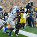 Michigan wide receiver Devin Gardner scores a touchdown as Air Force defensive back Christian Spears during the second half at Michigan Stadium on Saturday. Melanie Maxwell I AnnArbor.com